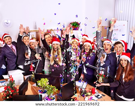 Happy group people in santa hat at Xmas business  party.