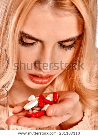 Illness woman having flu takes pills.
