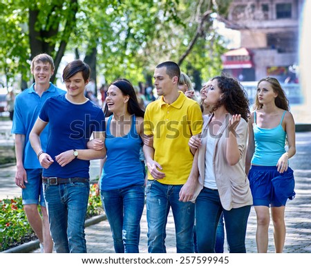Group happy people in summer outdoor.Cosual cloth.