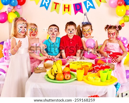 Group of children happy birthday party . Food on table.