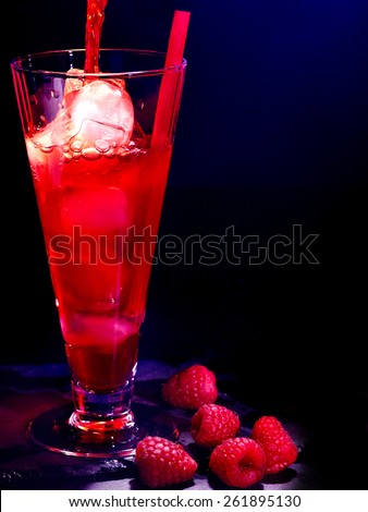 Red raspberry drink  with ice cube on black background. Cocktail card 12.