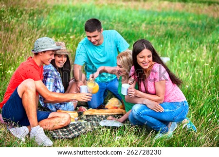 Group people male and female on picnic. Outdoor.