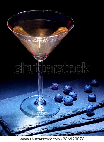 Blueberry gold drink on black background. Cocktail card 20