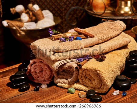 Luxury ayurvedic spa massage still life. Towel and stone.
