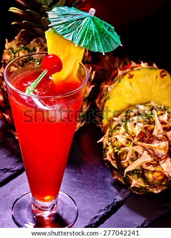 Pineapple cocktail with cherry and umbrella  in highball glass . Cocktail card 46