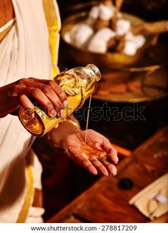 Indian woman hand having oil massage spa treatment.