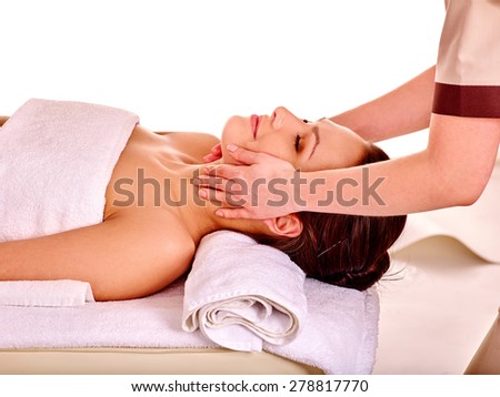 Young woman getting spa facial therapy . Isolated.