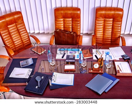 Business interior with  table and leather chair in office. Top view.
