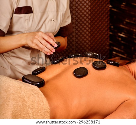 Man  having oil Ayurveda spa treatment. Body part and close up.