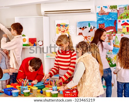 Group children painting at art school. Education.