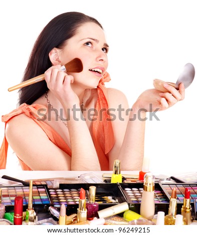 Girl applying makeup. Isolated.