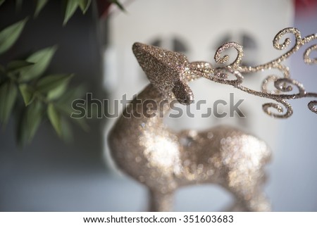 gold deer with christmas tree
