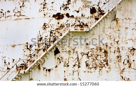 rusty stairs on an industrial petrochemical storage tank