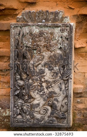 very old evil spirit carving at bali mother temple