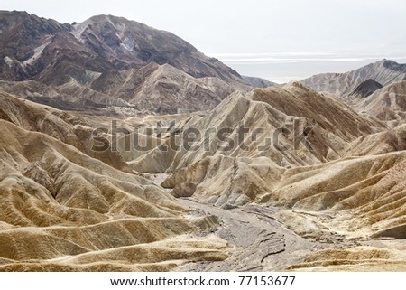 Zabriskie Point is located in east of Death Valley in Death Valley National Park in the us noted for its erosional landscape.Composed of sediments from Furnace Creek Lake  5 million years ago