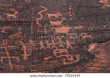 fire canyon weathered fading ancient indian petroglyphs. Some evidence of modern vandalism disfiguring is evident