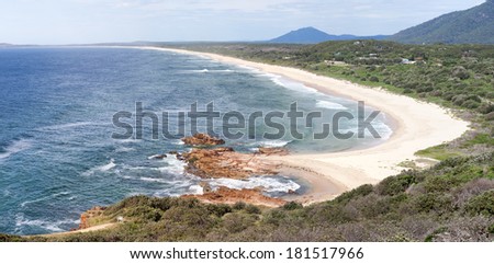 Gaze across the golden sands of Dunbogan Beach as it sweeps around to Diamond Head in Crowdy Bay National Park from  Charles Hamey lookout NSW Australia