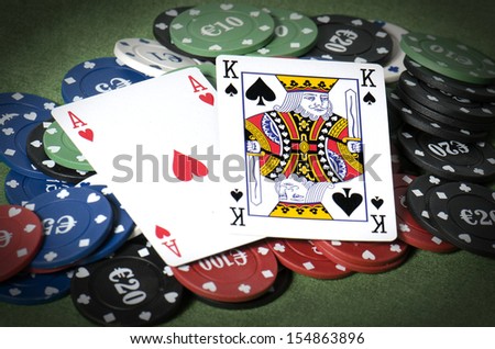 King more ace on gambling chip in hand poker