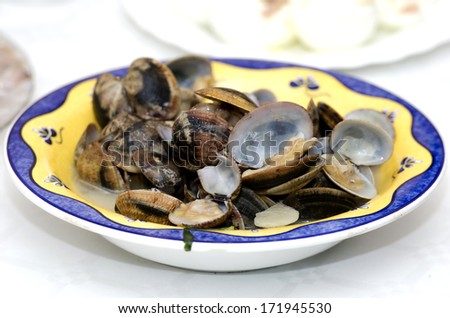 Dish Clams cooked in sauce, served in a restaurant