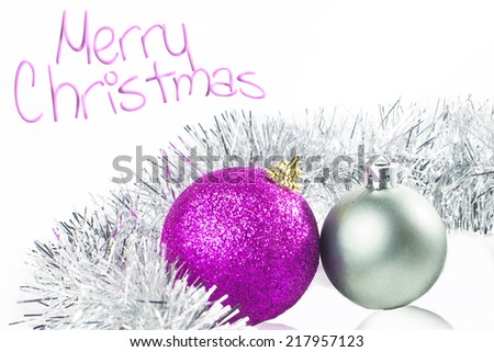 Christmas card with ornaments silver and purple with white background.