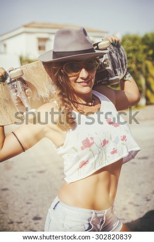 Sexy woman with Skateboard and analog film effect