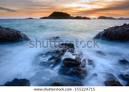 The beach in Thailand.The beach is belong to the Thai Navy. I wait until the sunset and see the twilight and use long duration of shutter speed to capture the flow motion of the wave