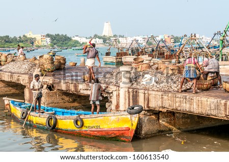 RAMESHWARAM,INDIA - JANUARY 29,2013 - Small Boats imported fish caught in the Indian Ocean.It starts unloading fish.