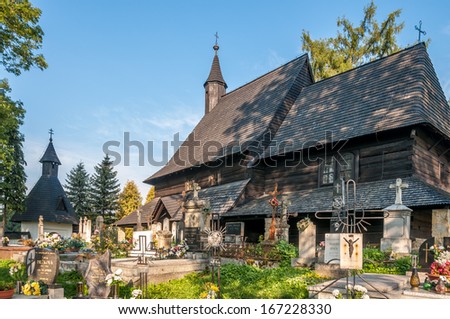 TVRDOSIN, SLOVAKIA - AUGUST 31,2013 - Cemetery and Wooden Church All Saints.Wooden Gothic church from the first half of the 15th century.In 2008 entered the UNESCO World Cultural and Natural Heritage.