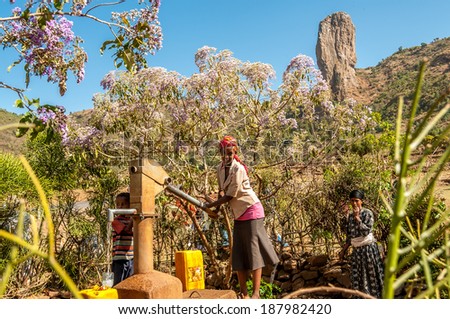 WERETA, ETHIOPIA - MARCH 23,2014 - Drawing water from the well.Water is very rare in Ethiopia.People must import it over long distances.