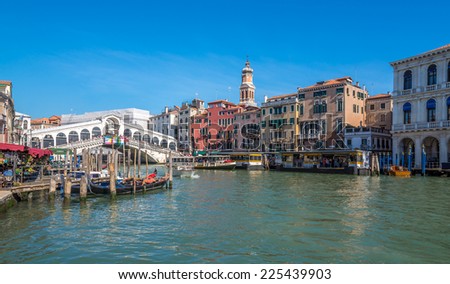 VENICE,ITALY - SEPTEMBER 23,2014 - View at the Canal Grande with bridge Rialto in Venice.Canal Grande is lined with magnificent palaces. City tour can also take place on the boat - gondola.