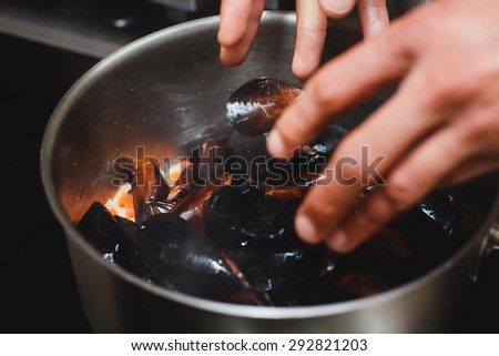 Chief cooking mussels