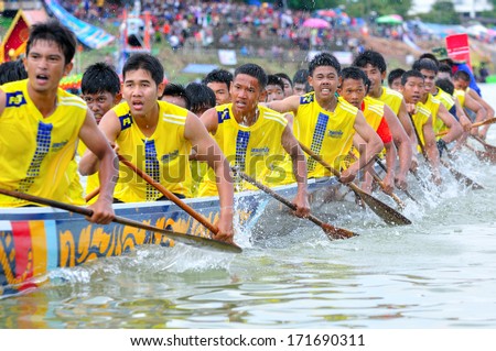 CHUMPHON, THAILAND-OCT 21: Unidentified rowers in Climbing Bows toward Snatching a Flag native Thai long boats compete during Native Long Boat Race Championship on Oct 21, 2013 in Chumphon, Thailand.