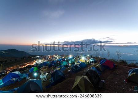 Camping on the big mountain in Phu Tub berk of Thailand as tourist style with sunrise sky