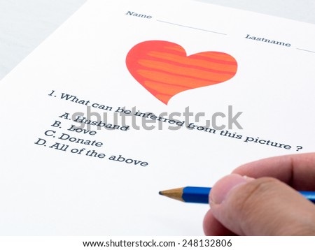 Questionnaire about picture heart and relate word,  filling out answers to a test with a blue pencil. Is this call Love. (Close-up choice)