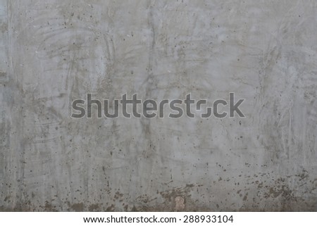 texture of the dirty gray polished concrete wall with scratches for background