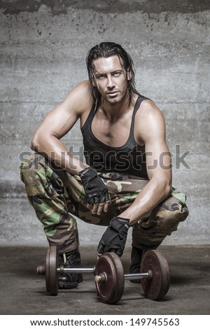 handsome muscle man wearing camouflage pants