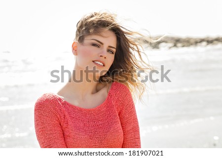 Wind hair beautiful girl smiling on camera