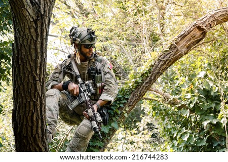 Portrait of Soldier in uniform of the U.S. Army on the trees