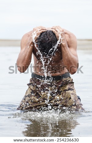 Close up Muscled Army in Camouflage Pants Bathing at the Sea After Outdoor Training