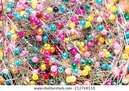 the many sewing push pins together in the sewing tool box