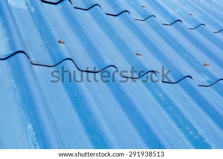 blue roof top with nuts and bolts over under the sun light