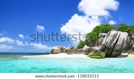 Seychelles. The island of dreams for a rest and relaxation. White coral sand on a tropical beach. Big Sister Island, location south-eastwards of La Digue island.