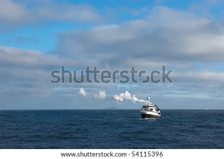 Catcher boat in antarctic area near icebergs Orkney Islands