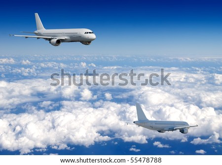 Several aircraft in blue sky