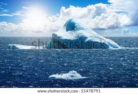 Antarctic ice island with penguins  in atlantic ocean