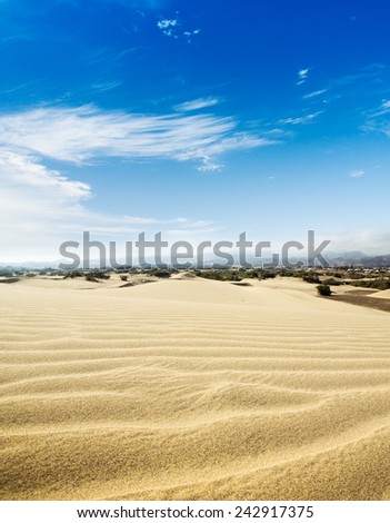 Blue sky and sand dunes. Sunny day. Canary islands, Maspalomas. Spain.