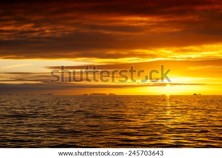 Floating iceberg in the ocean at sunset. Antarctica, southern ocean.