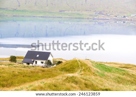 Residential house on the ocean . The Faroe Islands.
