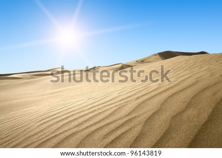 Gold desert into the sunset. Canary Islands, Canaries. Grand Canary. Maspalomas, Resort Town.
