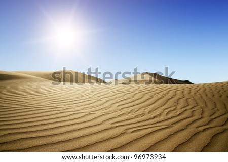 Gold desert into the sunset. Canary Islands, Canaries. Grand Canary. Maspalomas, Resort Town.